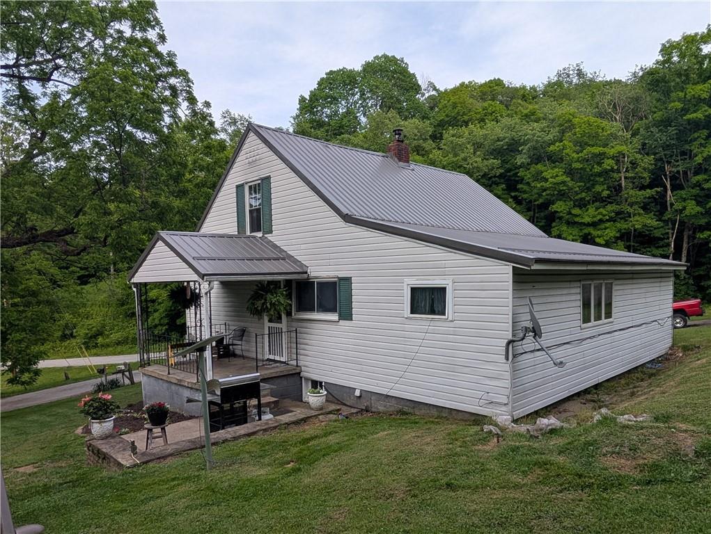 205 Woods Road Ligonier, PA 15658 - Photo 22 of 32 a aerial view of a house with swimming pool and a garden