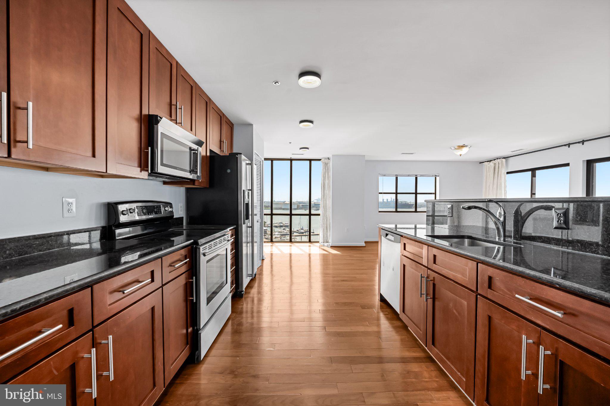 2702 Lighthouse Point East, Unit 738 Baltimore, MD 21224 - Photo 6 of 33 Modern kitchen with stunning views.