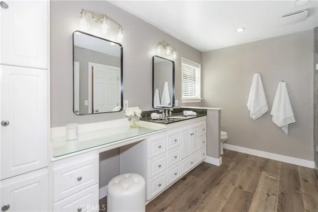a bathroom with a double vanity sink and mirror