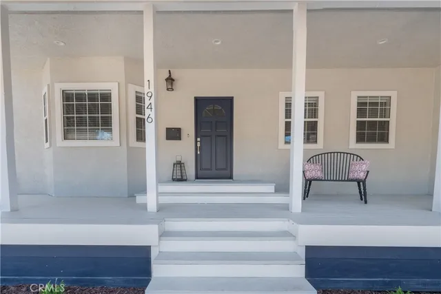 a view of front door with chair and mirror