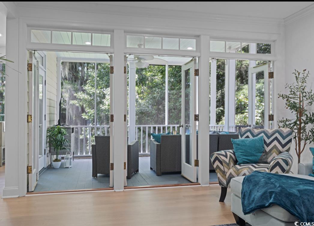 1970 Governors Landing Road, Unit 201 Murrells Inlet, SC 29576 - Photo 15 of 25 Entryway withLVP floors, crown molding, Leading to Screened in Porch