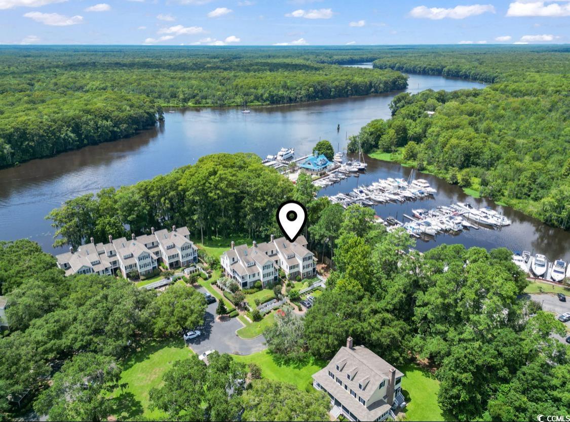 1970 Governors Landing Road, Unit 201 Murrells Inlet, SC 29576 - Photo 2 of 25 Aerial view of property and surrounding area featuring a marina and a nearby body of water