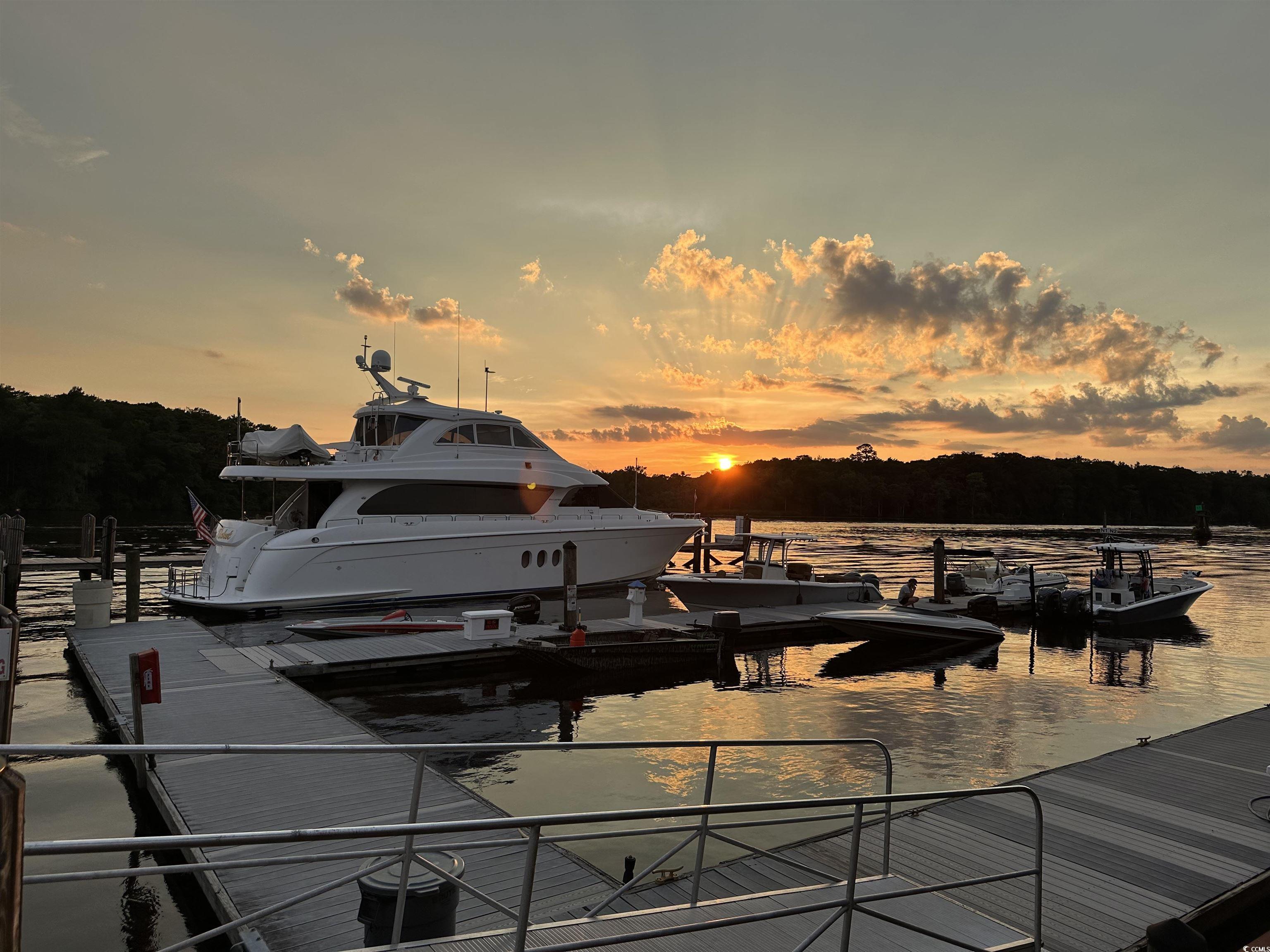 1970 Governors Landing Road, Unit 201 Murrells Inlet, SC 29576 - Photo 24 of 25 Marina right next door. Dock area featuring a water view