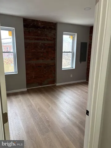 wooden floor and window in an empty room