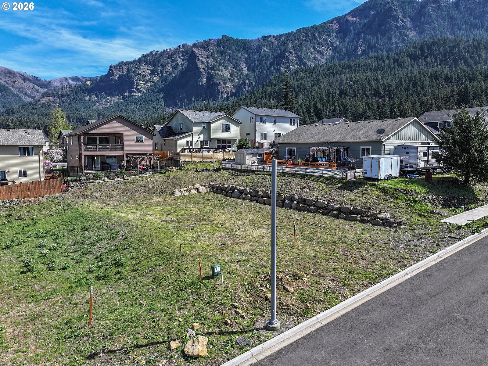 Manchester Drive Cascade Locks, OR 97014 - Photo 5 of 12 a aerial view of a house next to a yard