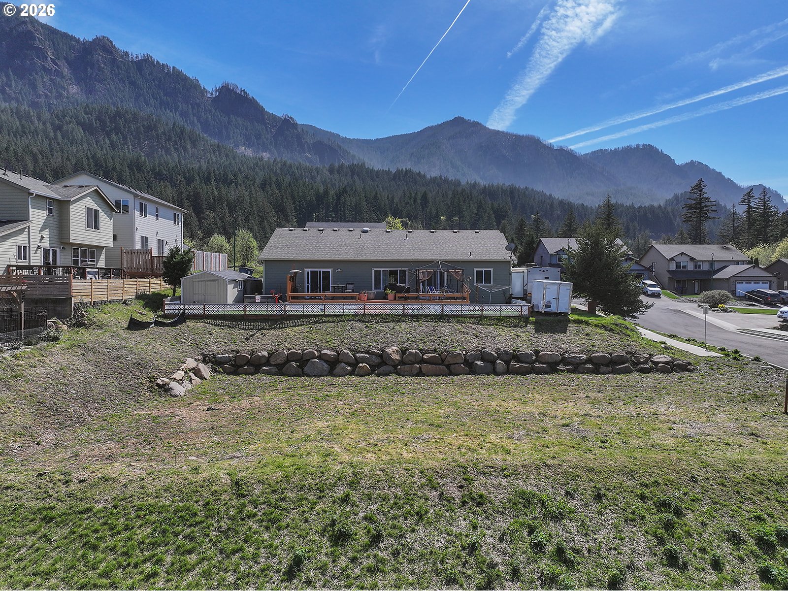 Manchester Drive Cascade Locks, OR 97014 - Photo 6 of 12 a view of a town with mountains front of house