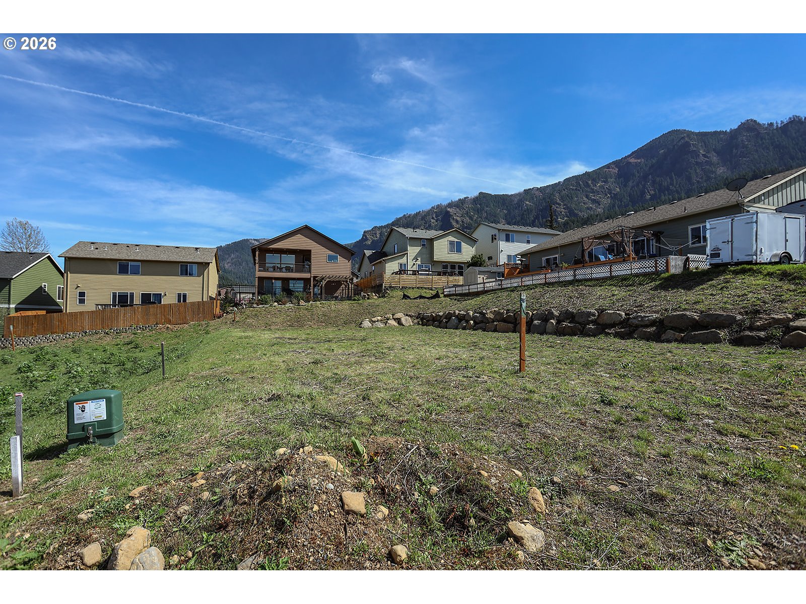 Manchester Drive Cascade Locks, OR 97014 - Photo 7 of 12 a view of a big house with a big yard and large trees