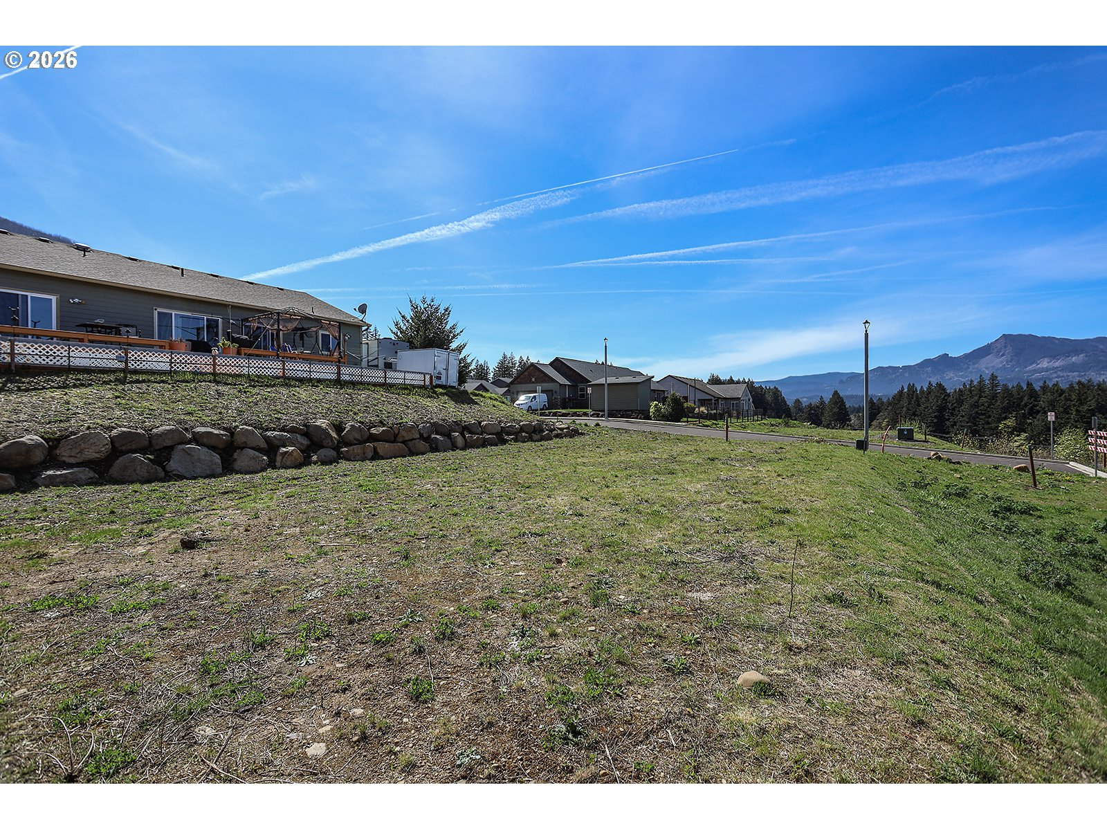 Manchester Drive Cascade Locks, OR 97014 - Photo 8 of 12 a view of a house with a yard