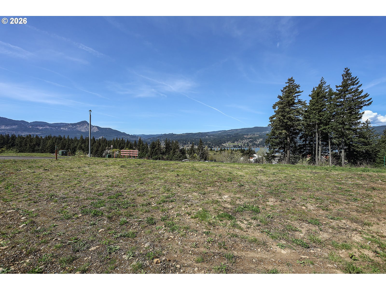 Manchester Drive Cascade Locks, OR 97014 - Photo 10 of 12 a view of a field with an trees in the background