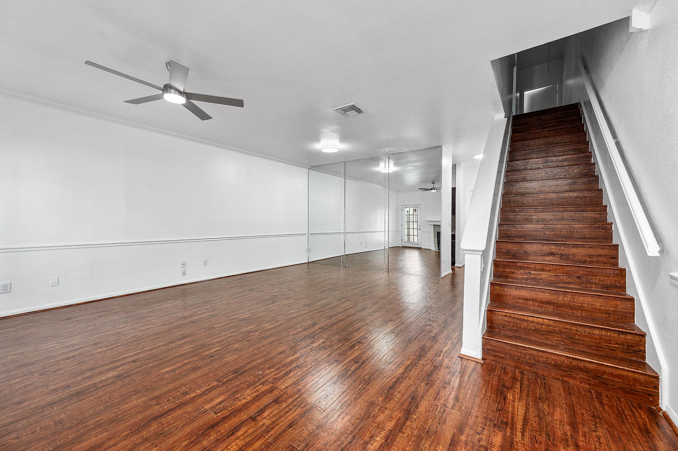 6000 Reims Road, Unit 2003 Houston, TX 77036 - Photo 5 of 24 wooden floor in an empty room with wooden floor