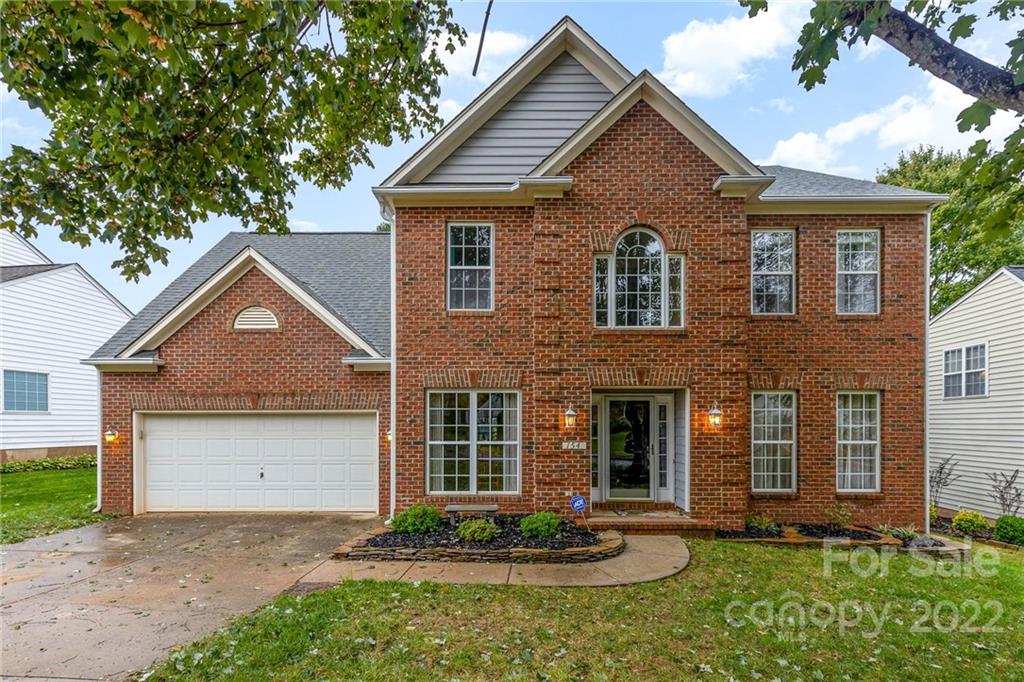 154 Coronilla Road Mooresville, NC 28117 - Photo 1 of 38 a front view of a house with a yard and garage