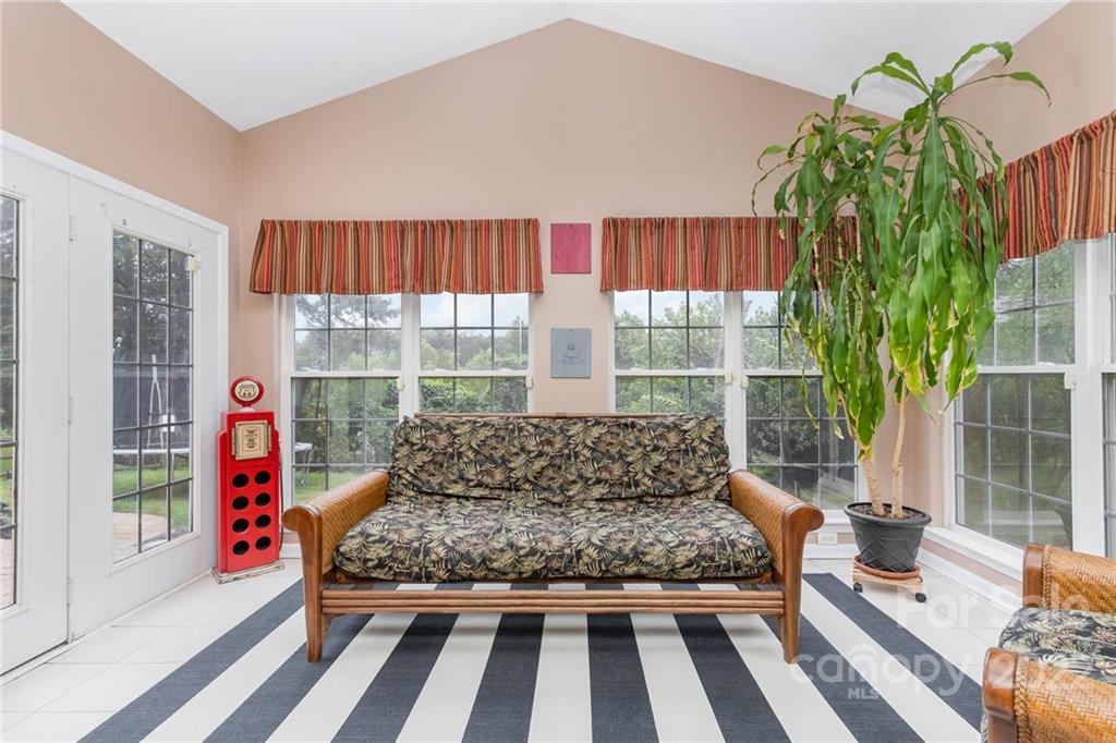 154 Coronilla Road Mooresville, NC 28117 - Photo 13 of 38 a bed sitting in a bedroom next to a window