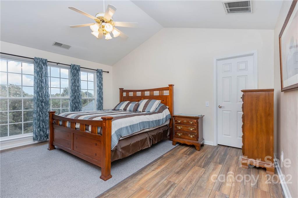 154 Coronilla Road Mooresville, NC 28117 - Photo 20 of 38 a bedroom with a bed and a window