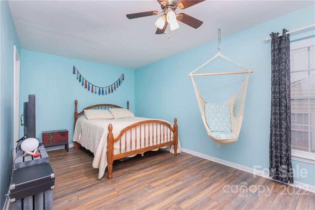 154 Coronilla Road Mooresville, NC 28117 - Photo 24 of 38 a bedroom with a bed lamp and a window