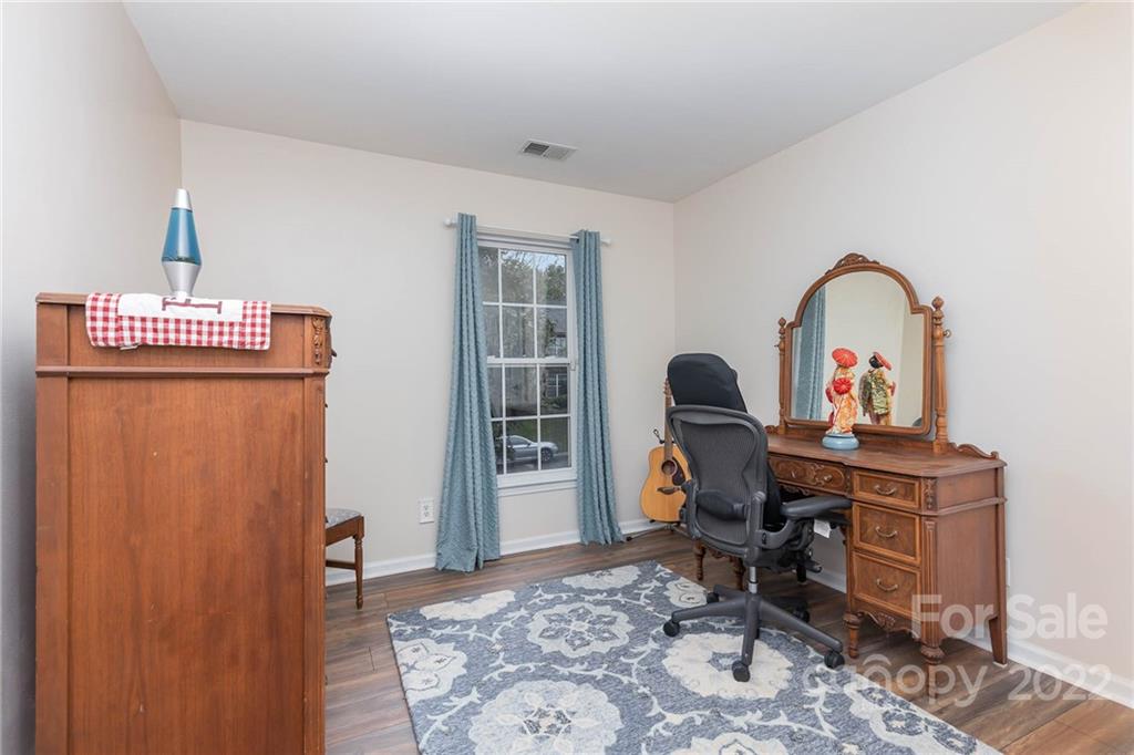 154 Coronilla Road Mooresville, NC 28117 - Photo 27 of 38 a view of a workspace with furniture and a gate