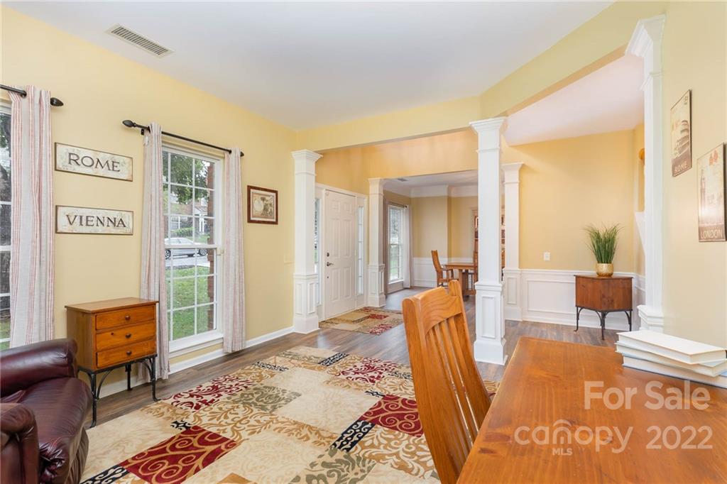 154 Coronilla Road Mooresville, NC 28117 - Photo 5 of 38 a spacious bedroom with a bed and wooden floor