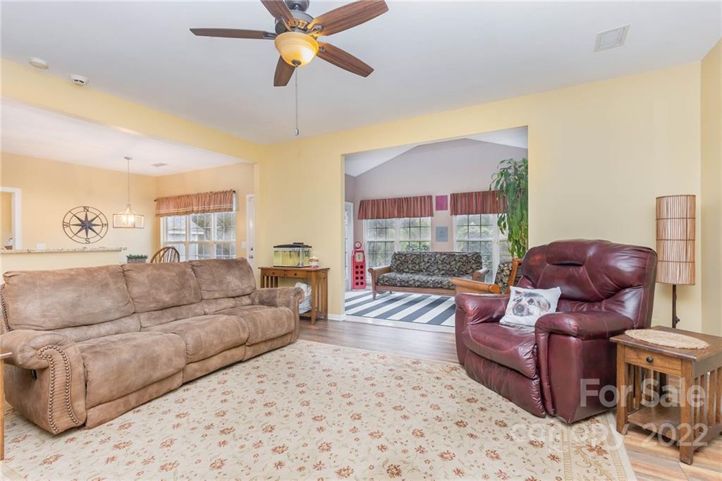 154 Coronilla Road Mooresville, NC 28117 - Photo 9 of 38 a living room with furniture and a ceiling fan