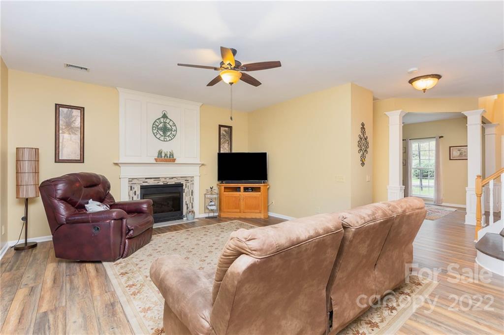154 Coronilla Road Mooresville, NC 28117 - Photo 10 of 38 a bedroom with a bed and a fireplace
