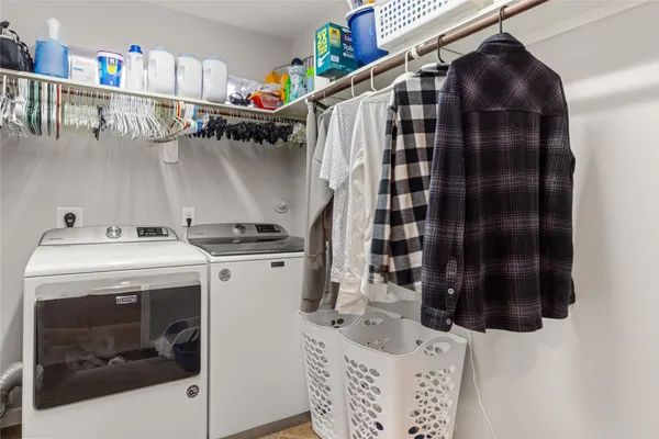 a utility room with dryer and washer