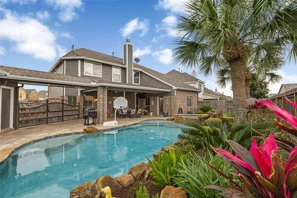 a front view of house and yard with seating space