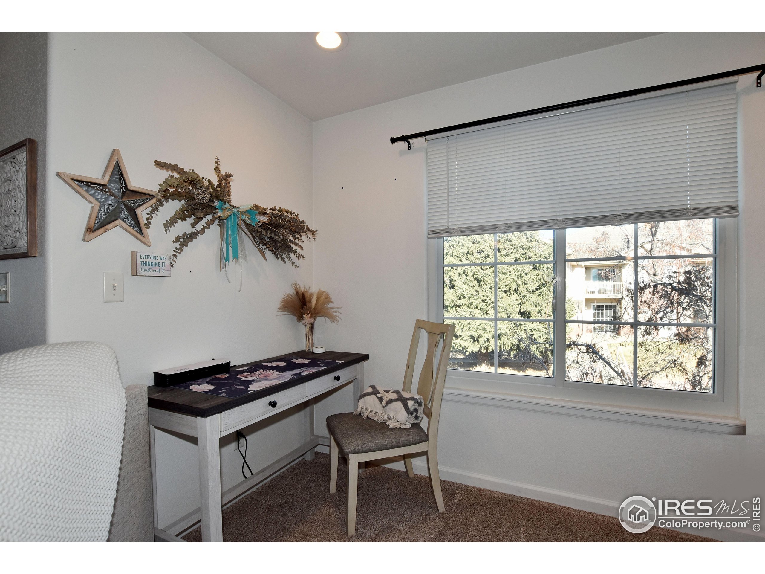 5151 West 29th Street Greeley, CO 80634 - Photo 12 of 40 a house with a table and a chair