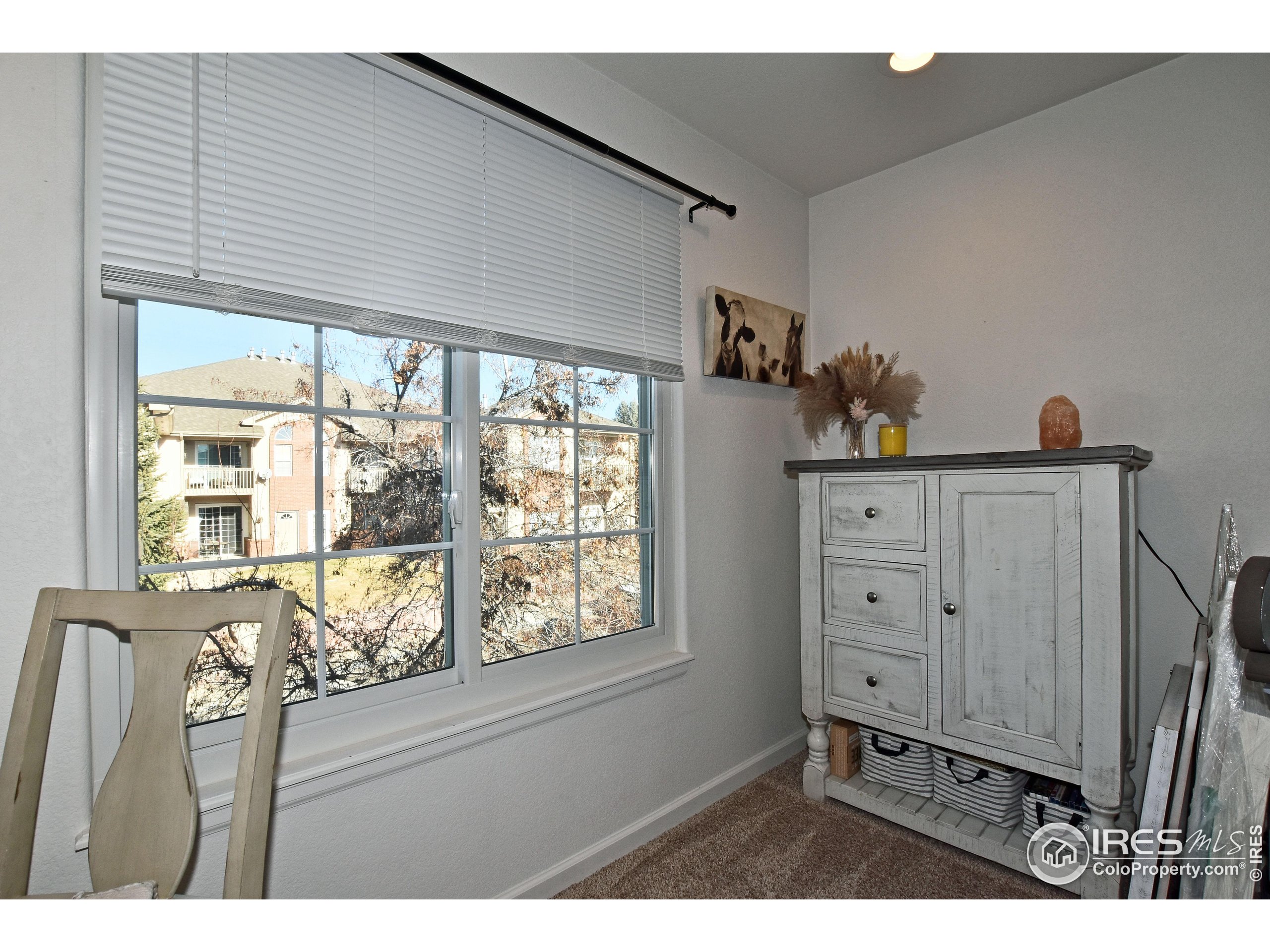5151 West 29th Street Greeley, CO 80634 - Photo 13 of 40 a living room with furniture and window