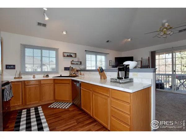 a kitchen with sink cabinets and window