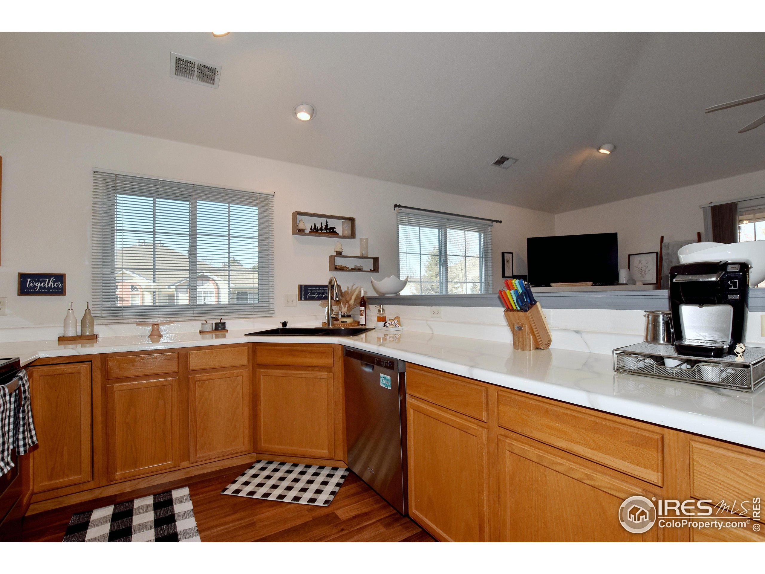5151 West 29th Street Greeley, CO 80634 - Photo 18 of 40 a kitchen with stainless steel appliances sink stove and microwave