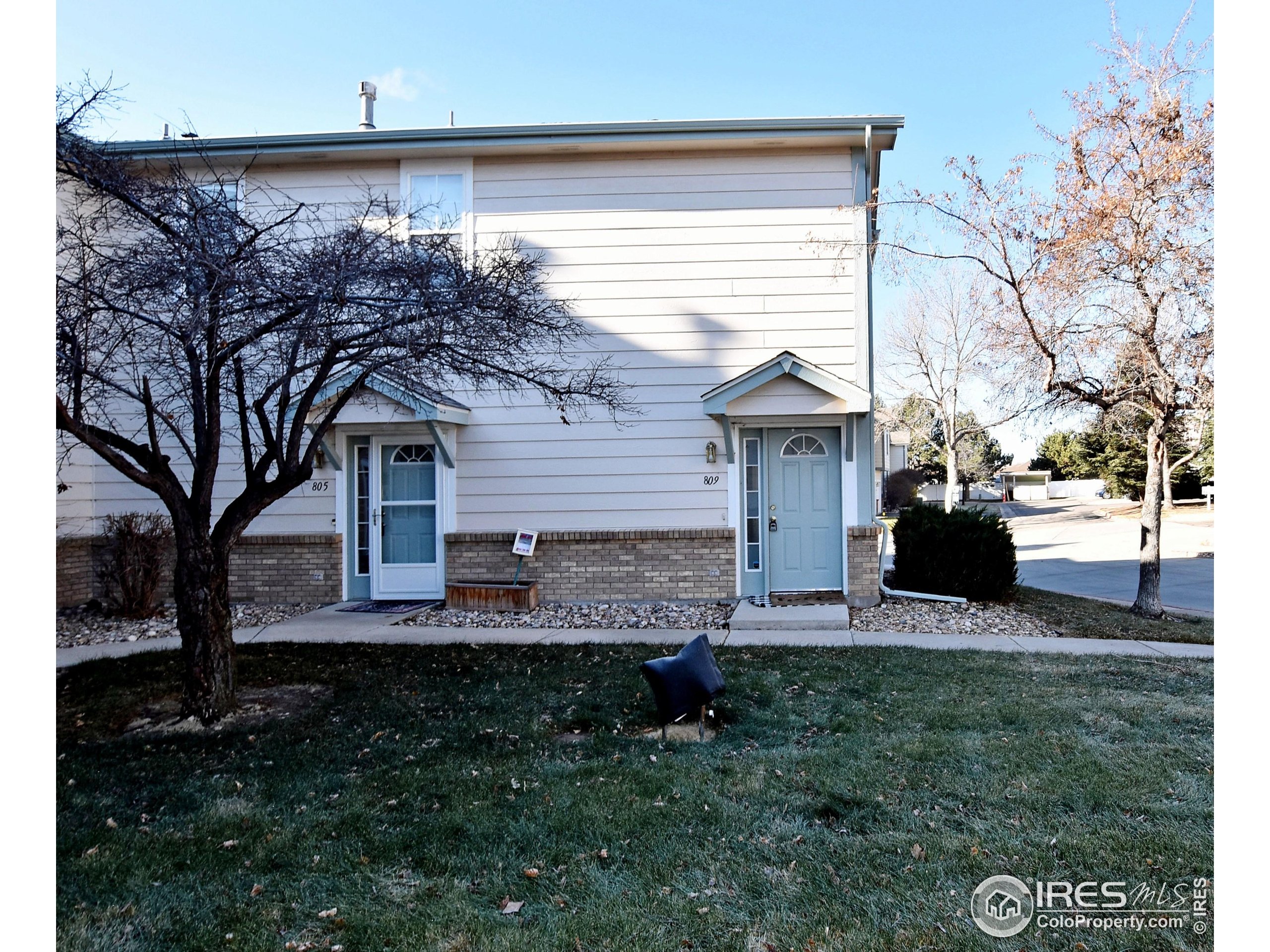 5151 West 29th Street Greeley, CO 80634 - Photo 2 of 40 a front view of a house with garden