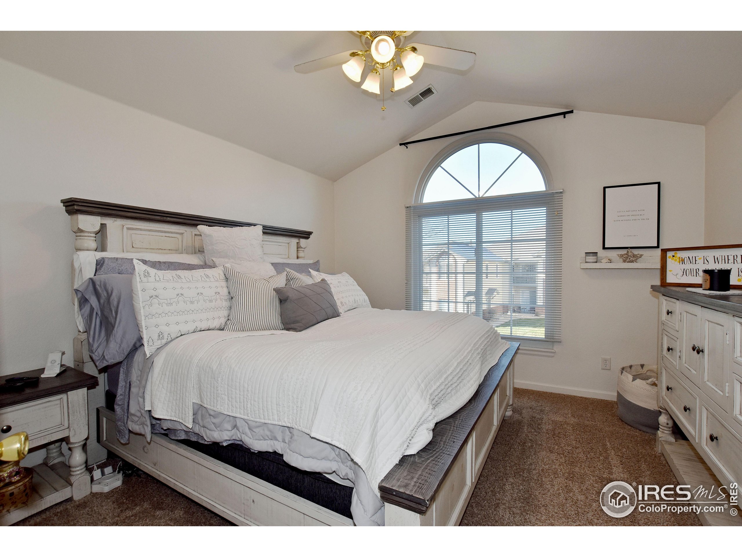 5151 West 29th Street Greeley, CO 80634 - Photo 21 of 40 a bedroom with a large bed and a window