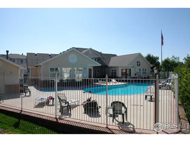 a view of a house with wooden fence