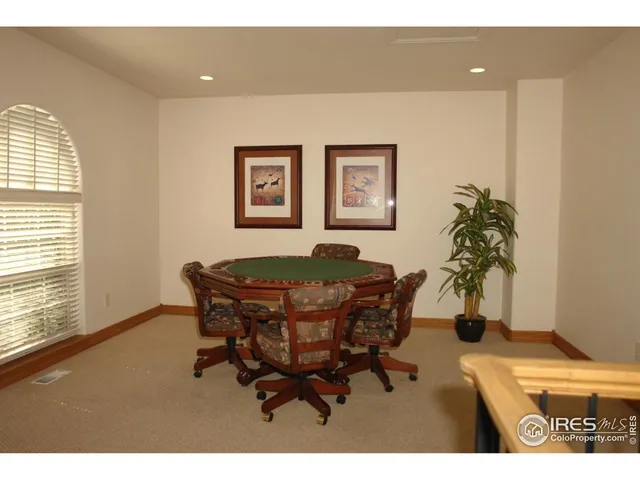 a workspace room with furniture and wooden floor