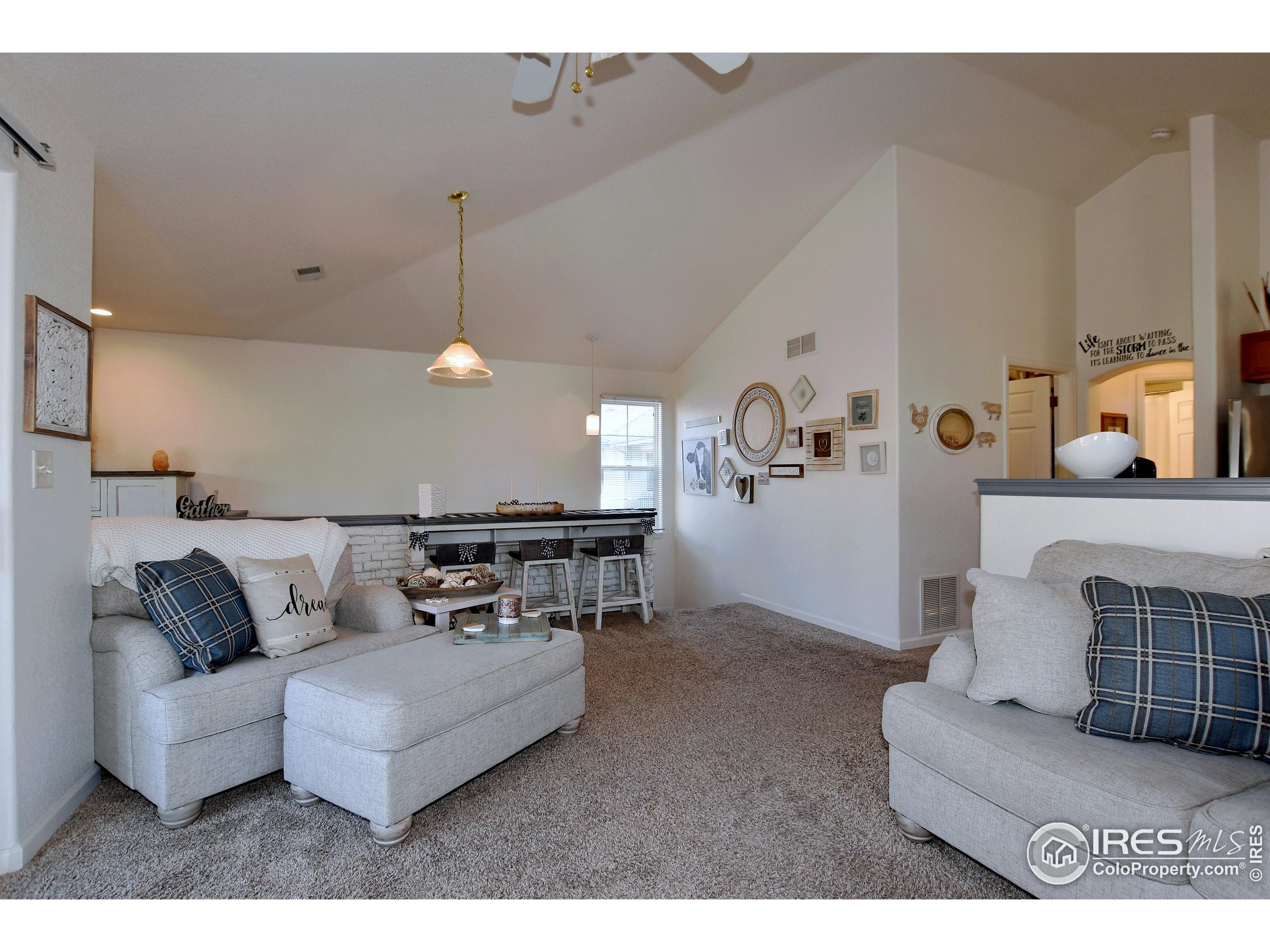 5151 West 29th Street Greeley, CO 80634 - Photo 8 of 40 a living room with furniture and wall painting