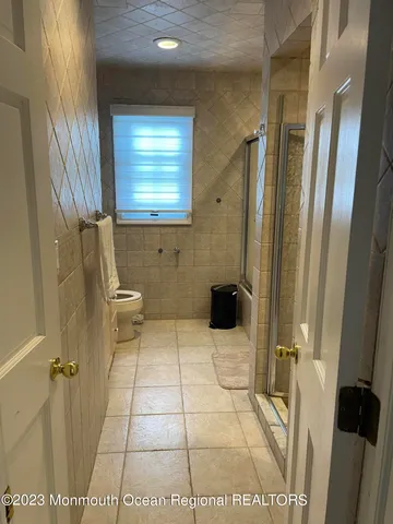 a bathroom with a bathtub and shower