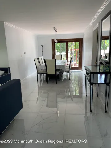 a view of a livingroom with furniture and a window