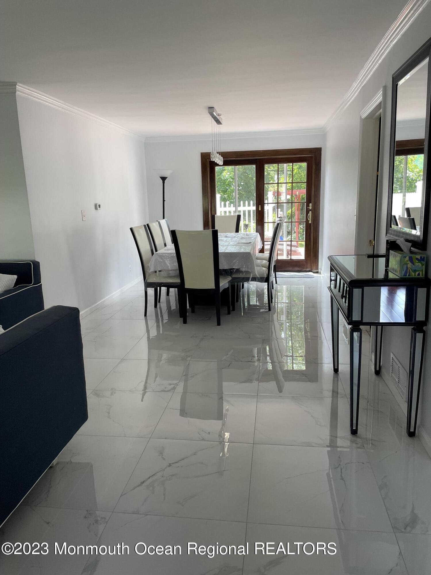 98 Neptune Avenue Deal, NJ 07723 - Photo 5 of 14 a view of a livingroom with furniture and a window