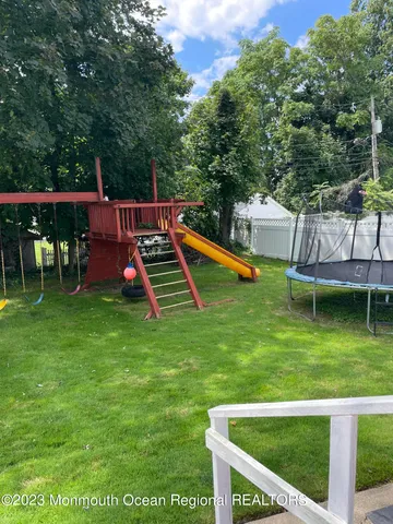 an outdoor view of a house having swimming pool