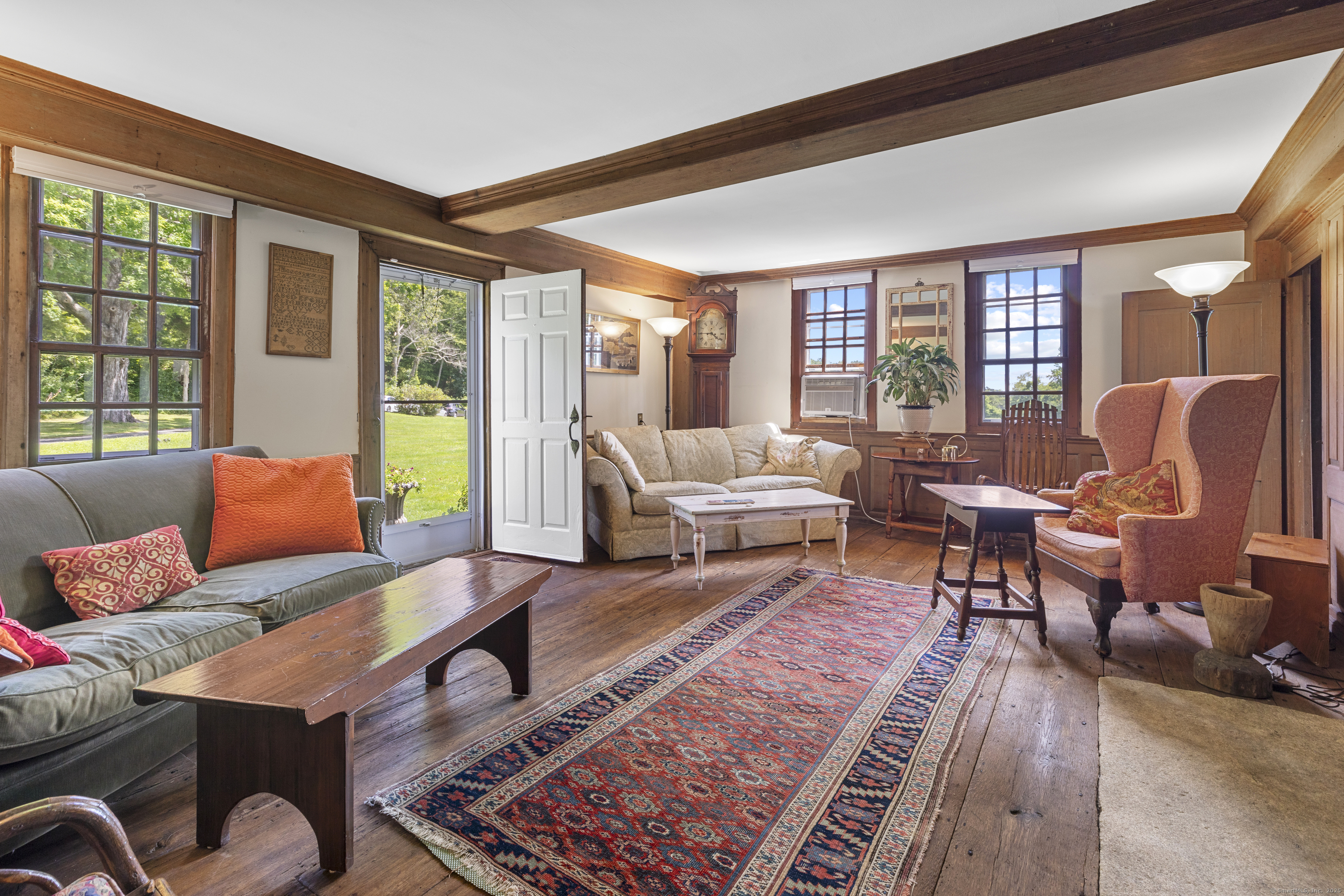90 Duck Hole Road Guilford, CT 06437 - Photo 19 of 38 a living room with furniture and a large window