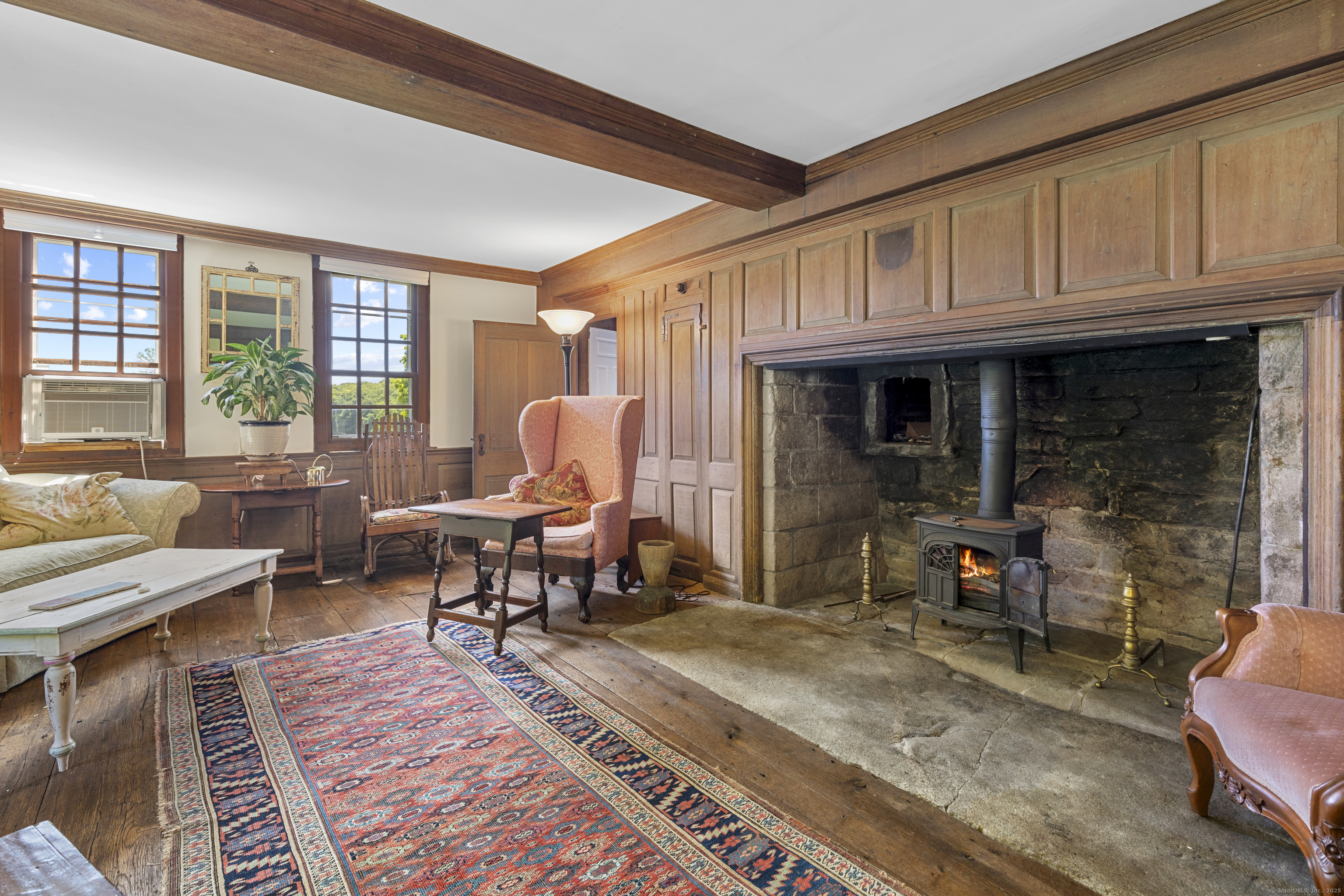 90 Duck Hole Road Guilford, CT 06437 - Photo 20 of 38 a living room with furniture a rug and a window