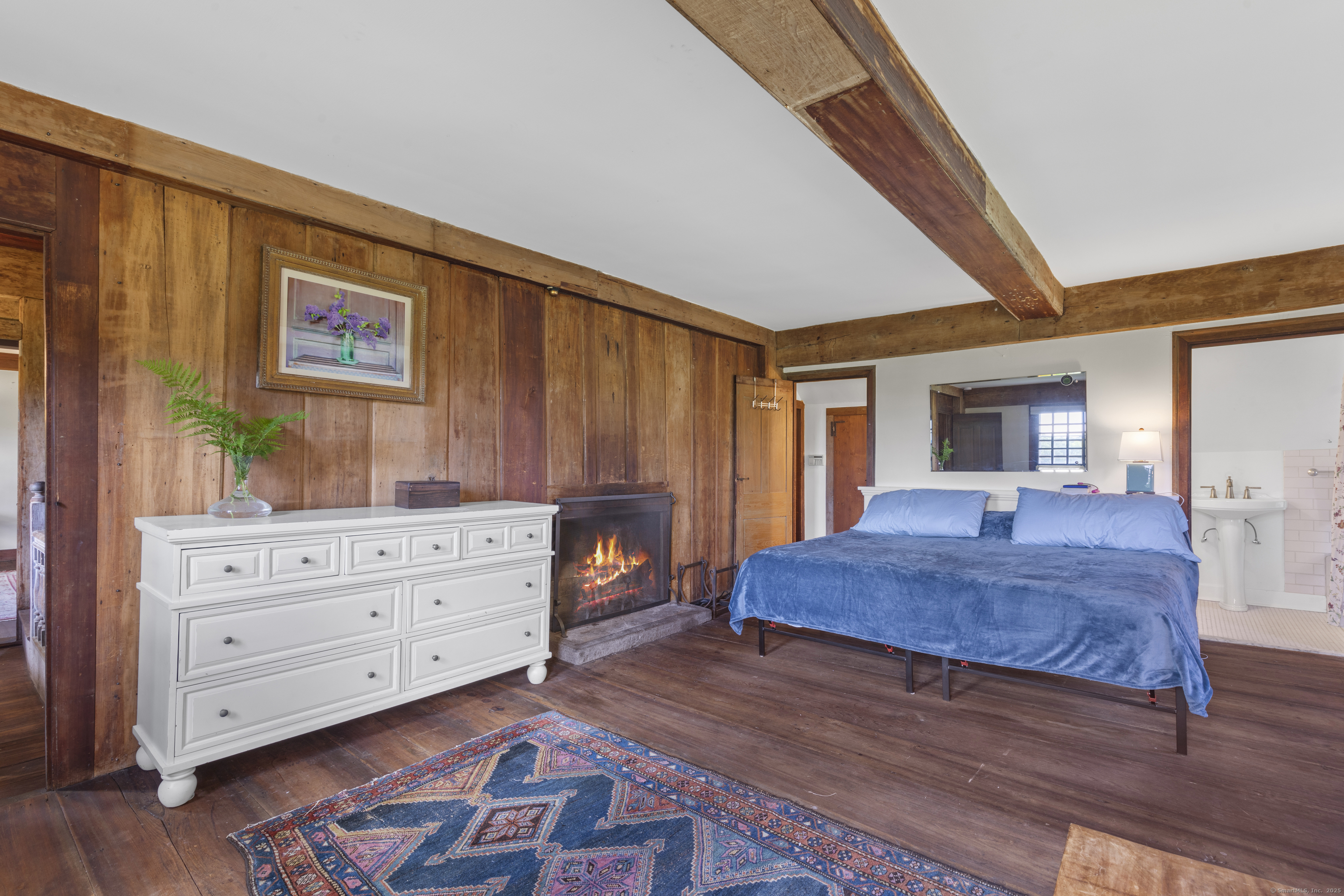 90 Duck Hole Road Guilford, CT 06437 - Photo 27 of 38 a bedroom with a bed and a dresser