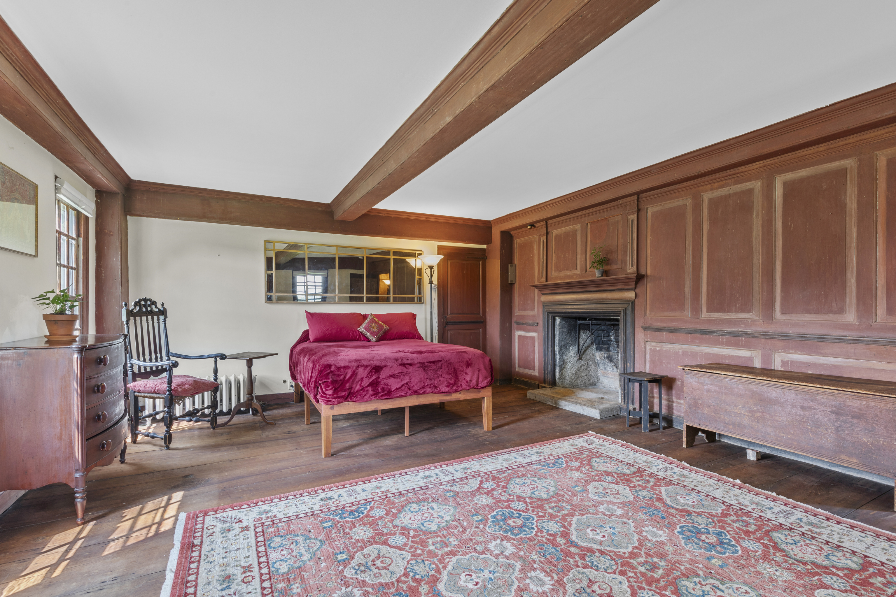 90 Duck Hole Road Guilford, CT 06437 - Photo 31 of 38 a living room with furniture and a fireplace