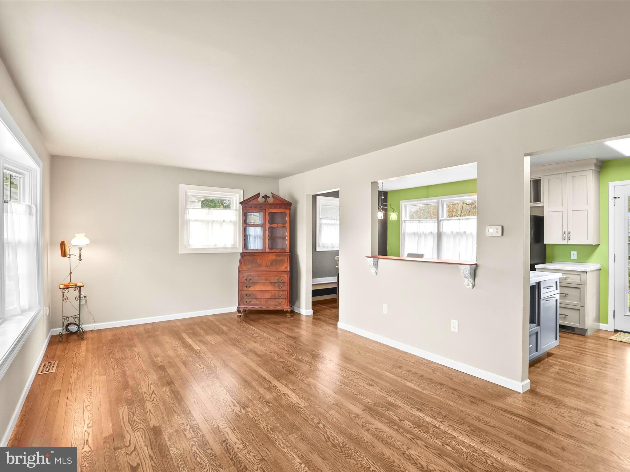 1316 Livingstone Road York, PA 17404 - Photo 12 of 33 a view of an empty room with window and wooden floor