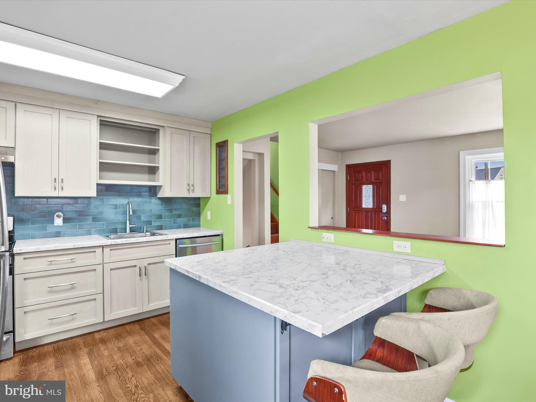 1316 Livingstone Road York, PA 17404 - Photo 17 of 33 a kitchen with a table chairs sink and cabinets