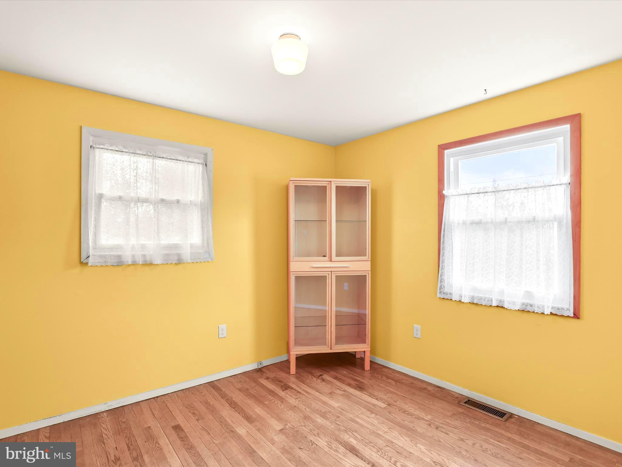 1316 Livingstone Road York, PA 17404 - Photo 21 of 33 a view of an empty room with wooden floor and a window