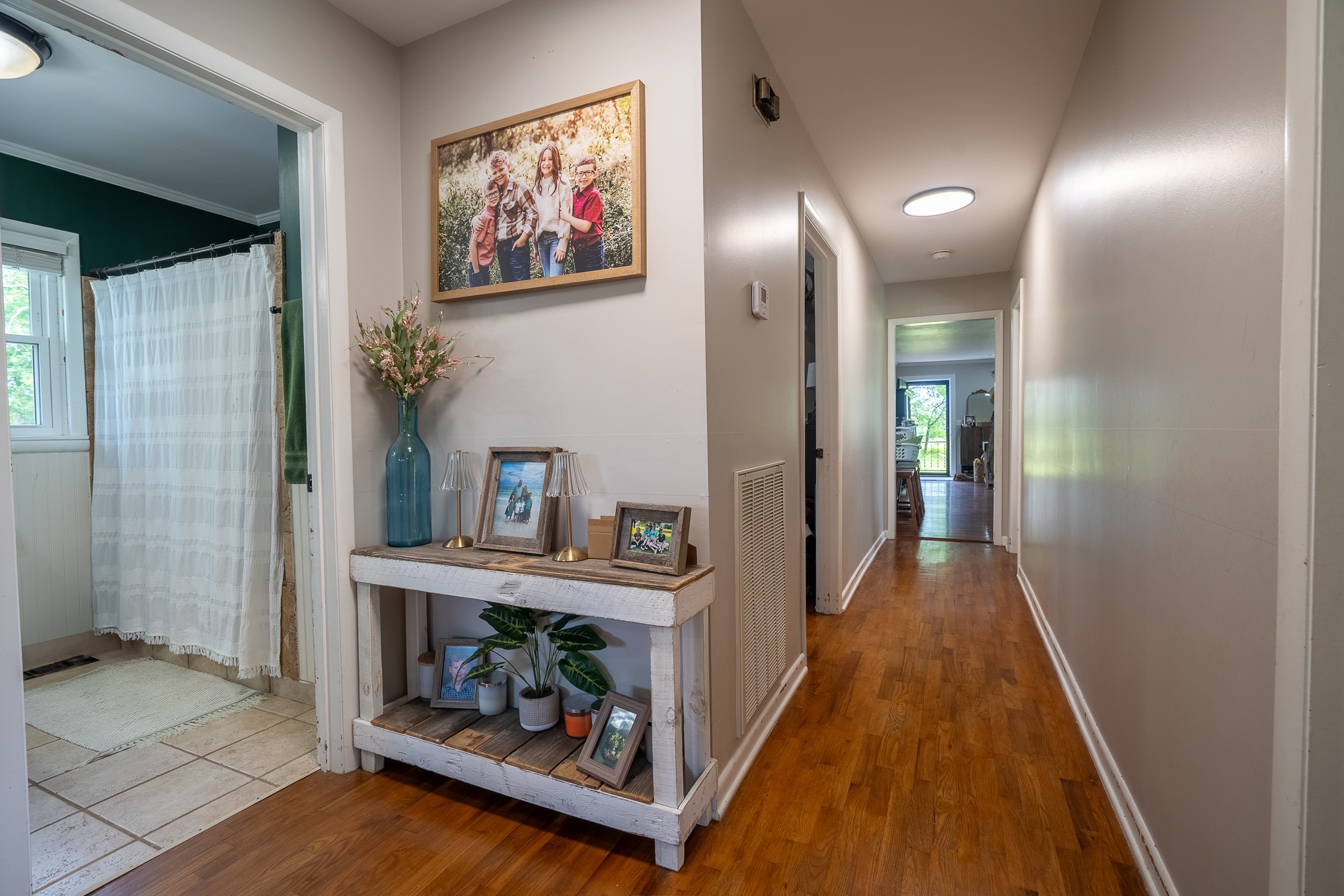 120 Revilo Road Leoma, TN 38468 - Photo 16 of 27 a view of a hallway to a livingroom with furniture and wooden floor