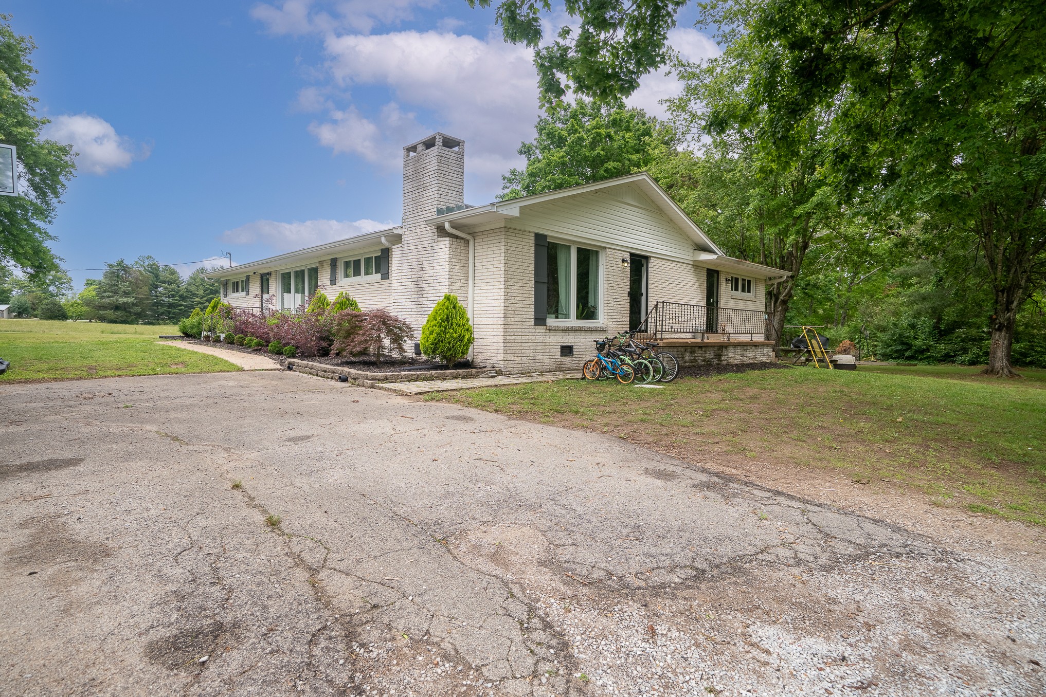 120 Revilo Road Leoma, TN 38468 - Photo 3 of 27 a front view of a house with a yard and garage