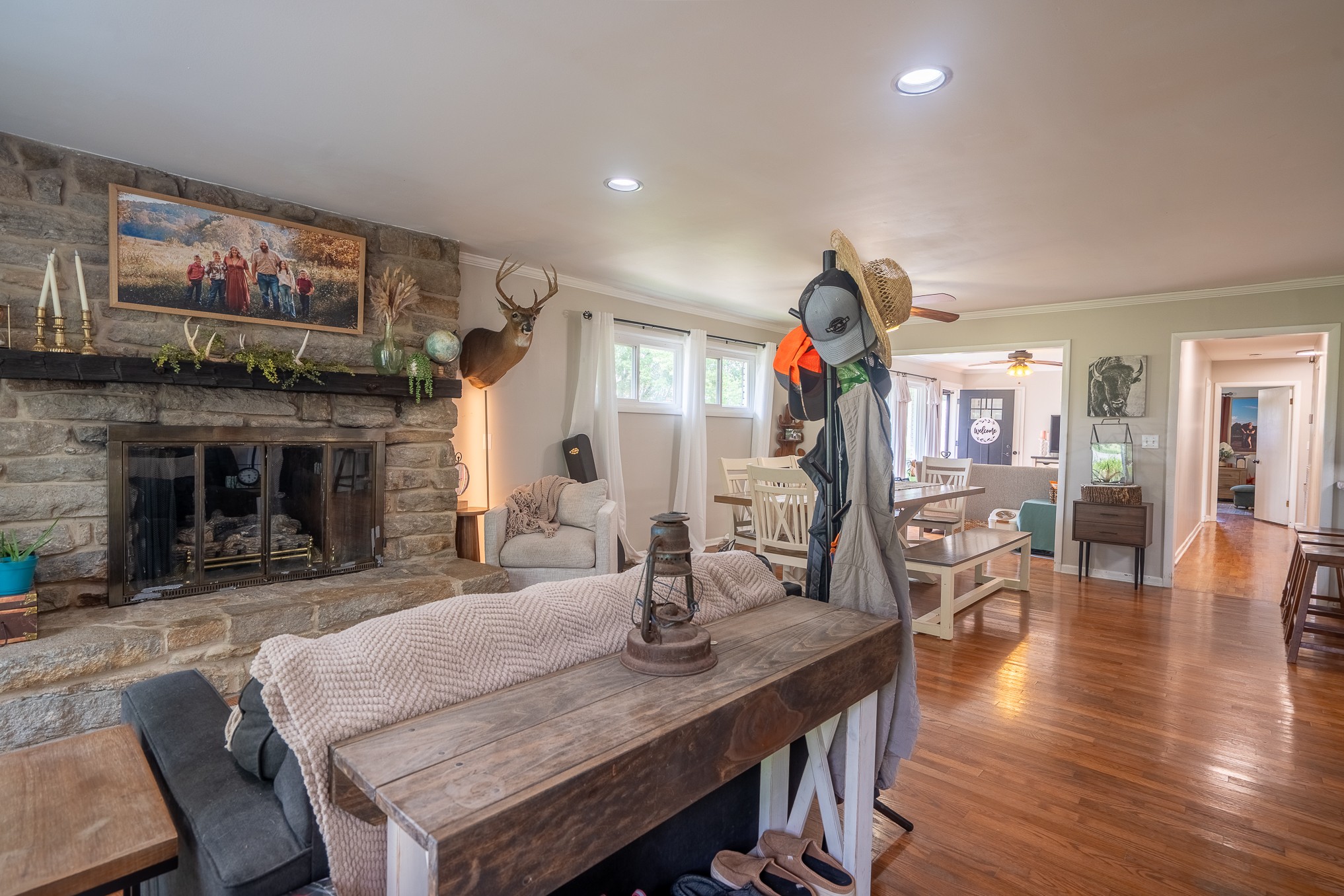 120 Revilo Road Leoma, TN 38468 - Photo 9 of 27 a dining area with furniture a fireplace and wooden floor