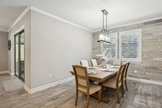a bedroom with a bed and a ceiling fan