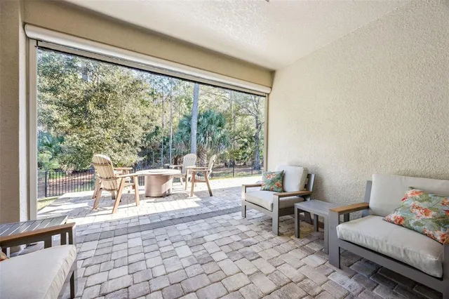 a view of a house with a yard and potted plants