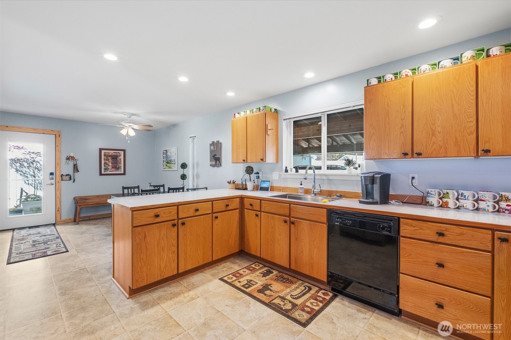 8348 Main Street, Unit 1 Peshastin, WA 98847 - Photo 11 of 40 a large kitchen with stainless steel appliances granite countertop a sink and cabinets